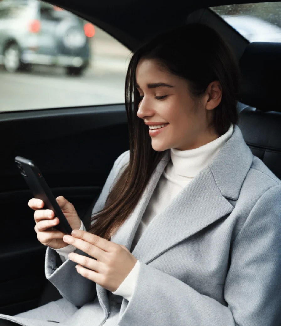 Happy woman in taxi