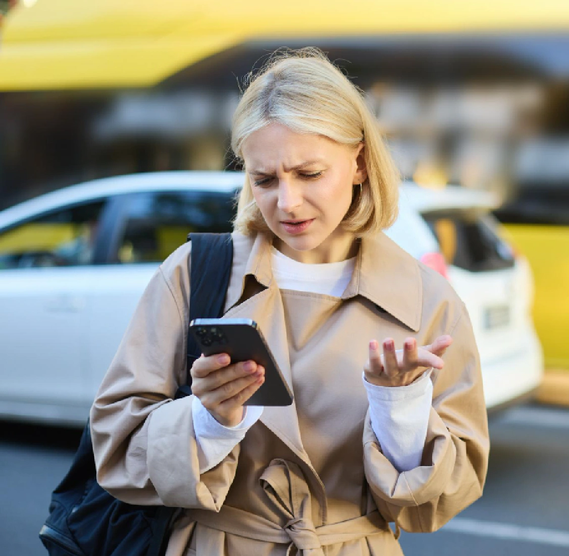 Confused woman checking phone